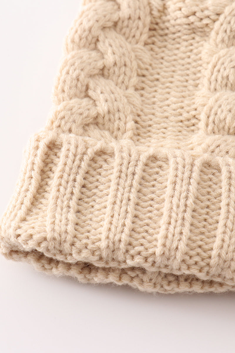 Beige pompom cable beanie